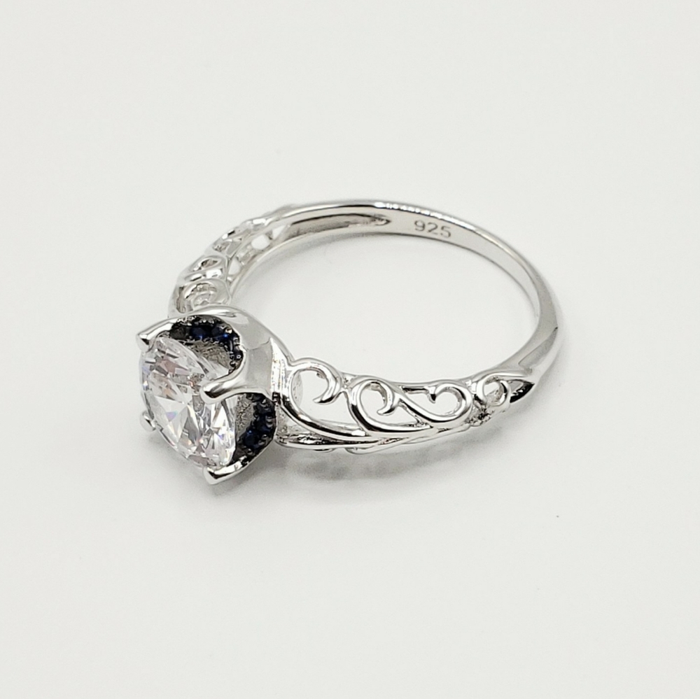 Round Cut Swirl Ring with Blue Accents